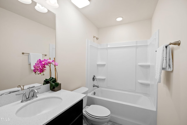 full bathroom featuring vanity, bathing tub / shower combination, and toilet