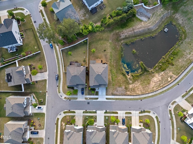 bird's eye view featuring a residential view and a water view