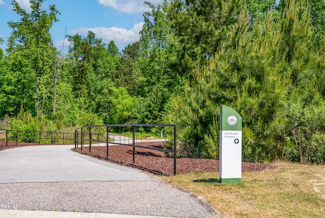 view of property's community with fence and playground community