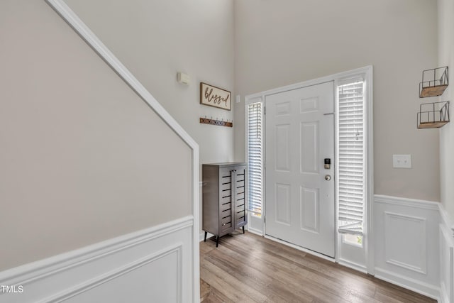 312 Grassy Point Rd, Apex, NC 27502 - entryway with a wainscoted wall and wood finished floors