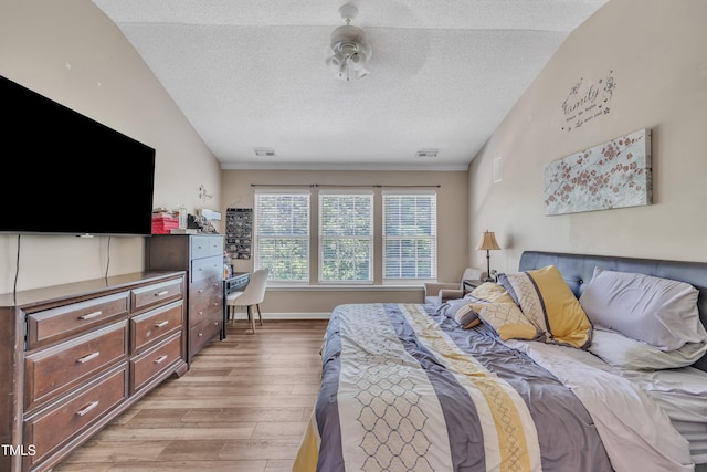 312 Grassy Point Rd, Apex, NC 27502 - bedroom featuring light wood finished floors, a textured ceiling, an office area, and baseboards