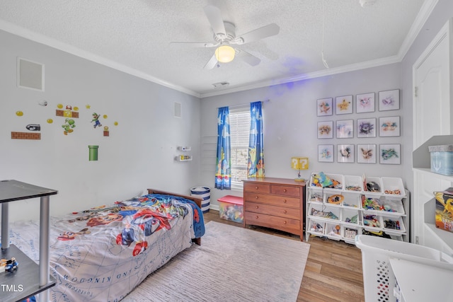 312 Grassy Point Rd, Apex, NC 27502 - bedroom with wood finished floors, a textured ceiling, crown molding, and ceiling fan