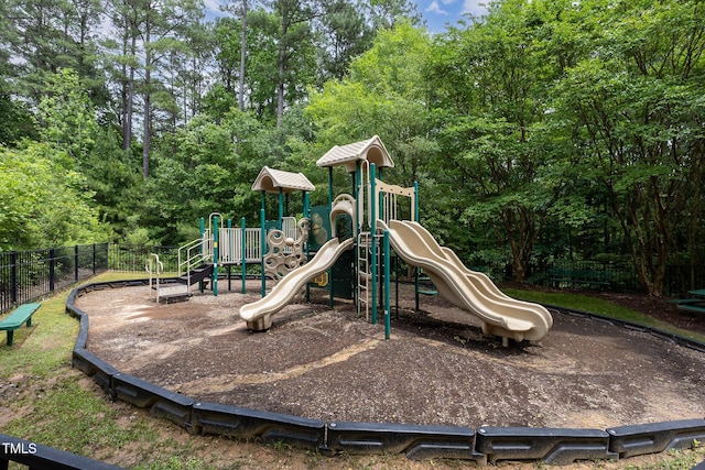 312 Grassy Point Rd, Apex, NC 27502 - communal playground featuring fence and view of wooded area