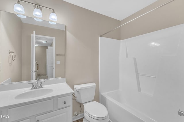 bathroom featuring toilet, bathtub / shower combination, and vanity