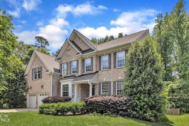 view of front of property with brick siding, an attached garage, driveway, a shingled roof, and a front lawn