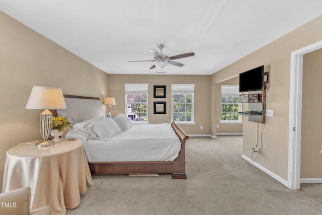 bedroom featuring carpet floors, baseboards, and ceiling fan
