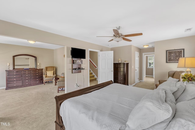 bedroom with light carpet, baseboards, and ceiling fan