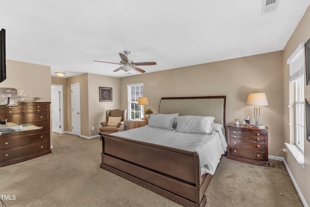 bedroom with carpet flooring, baseboards, and ceiling fan