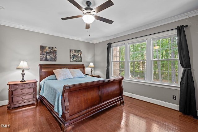 bedroom with baseboards, hardwood / wood-style flooring, ornamental molding, and ceiling fan