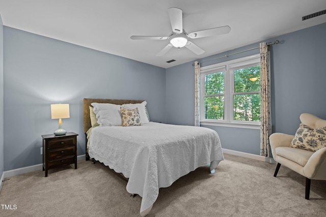 carpeted bedroom with baseboards and ceiling fan