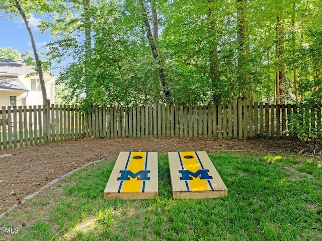 view of home's community with fence