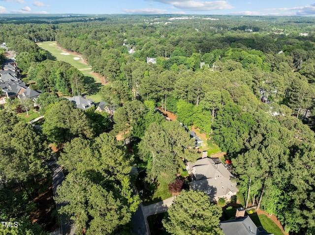 aerial overview of property's location featuring a forest
