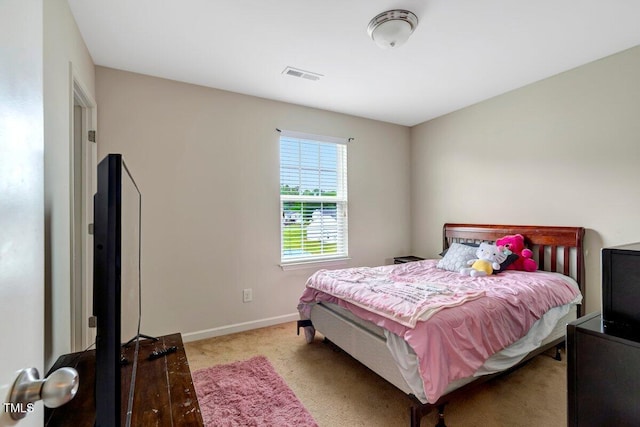 bedroom with baseboards, carpet, and visible vents