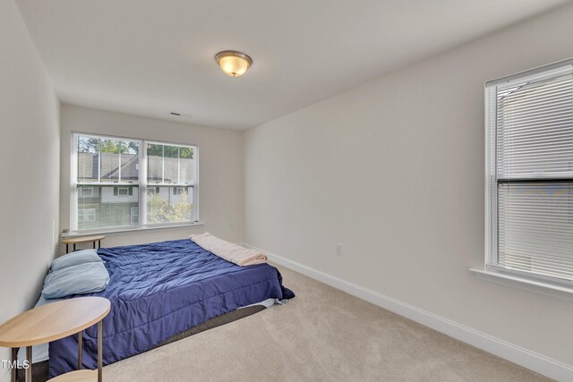 162 Channel Drop Dr, Clayton, NC 27520 - carpeted bedroom featuring baseboards