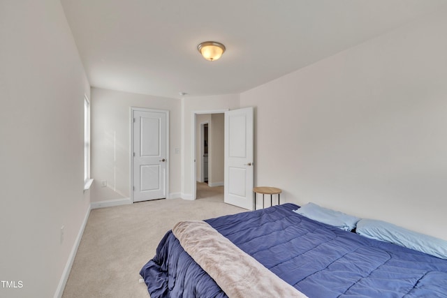 carpeted bedroom with baseboards