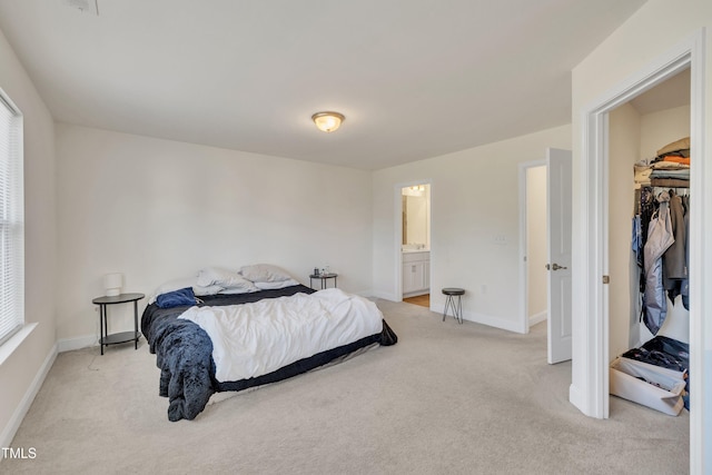 bedroom with light colored carpet, baseboards, and multiple windows