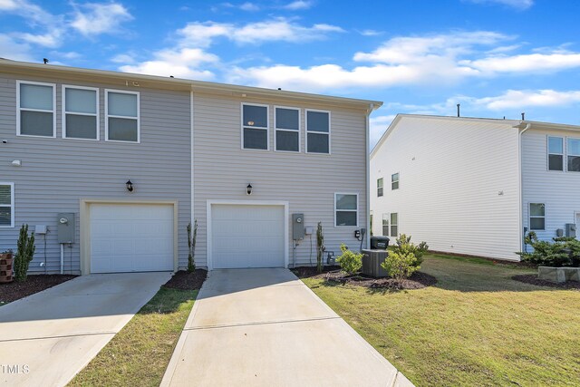 162 Channel Drop Dr, Clayton, NC 27520 - view of front of property with an attached garage, central AC, a front yard, and concrete driveway