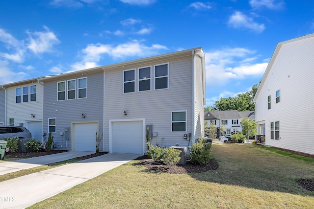 exterior space with a lawn, driveway, and a garage