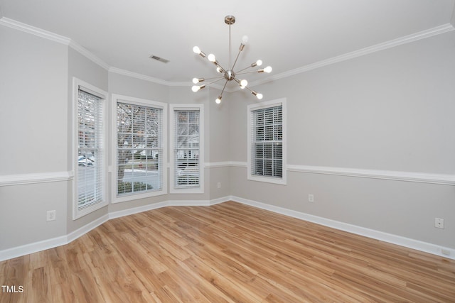 unfurnished dining area featuring light wood-style floors, visible vents, baseboards, an inviting chandelier, and ornamental molding