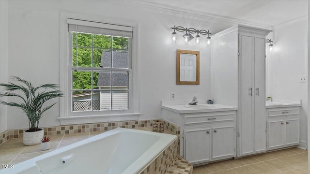 full bath with a garden tub, vanity, and crown molding