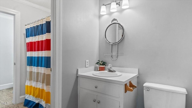 full bathroom with a shower with curtain, ornamental molding, vanity, and toilet