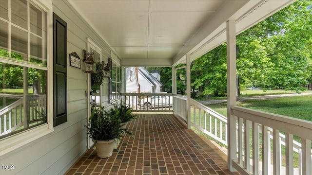 wooden terrace featuring a porch