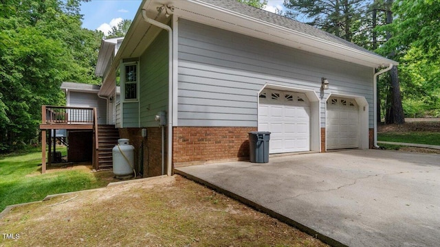 garage with concrete driveway