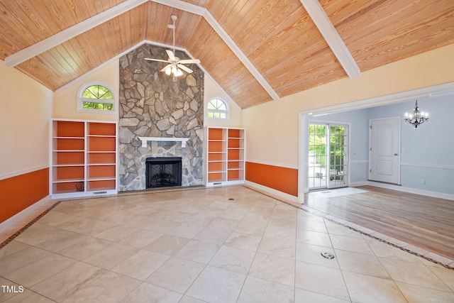 unfurnished living room with wooden ceiling, a ceiling fan, a fireplace, healthy amount of natural light, and a chandelier