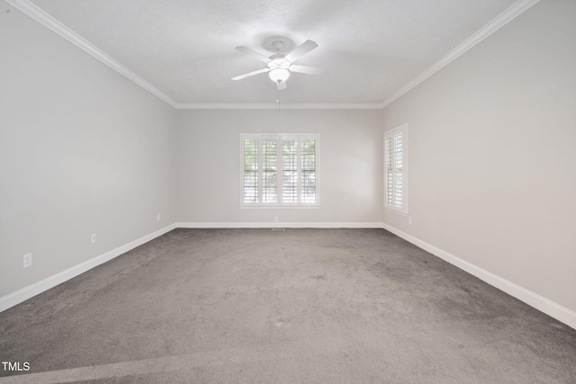 spare room with ceiling fan, crown molding, carpet floors, and baseboards