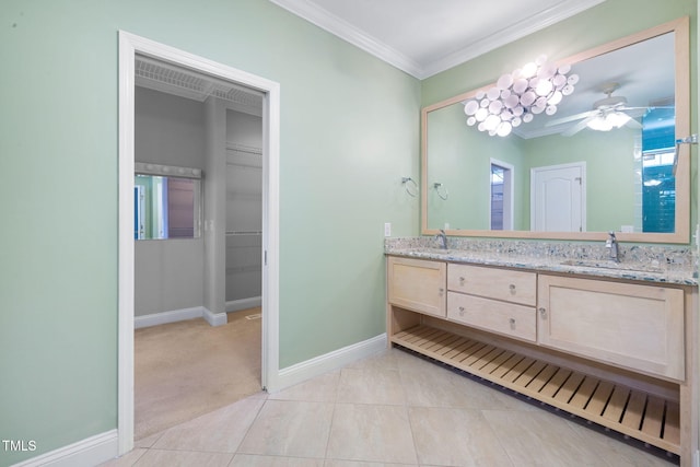 full bathroom featuring crown molding, double vanity, baseboards, a ceiling fan, and tile patterned flooring
