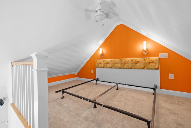 bedroom featuring lofted ceiling, carpet, ceiling fan, and ornamental molding