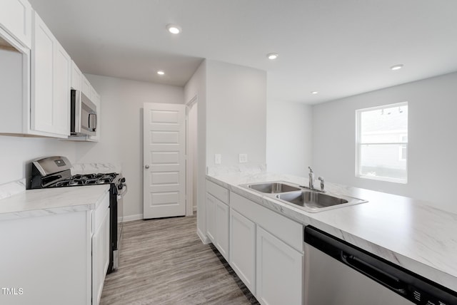 124 Landon Pl, Roxboro, NC 27573 - kitchen featuring a sink, light countertops, white cabinets, and stainless steel appliances