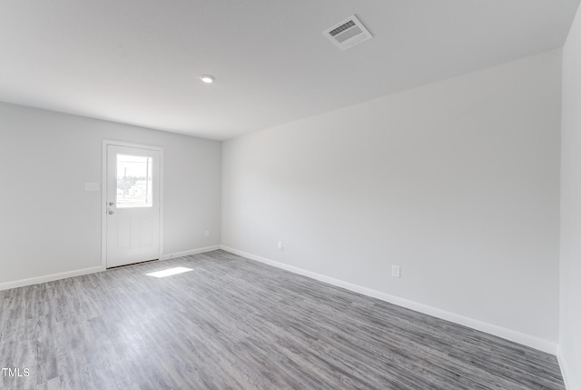 124 Landon Pl, Roxboro, NC 27573 - spare room featuring visible vents, baseboards, and wood finished floors