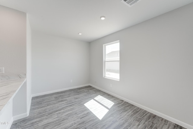 124 Landon Pl, Roxboro, NC 27573 - spare room featuring visible vents, recessed lighting, baseboards, and wood finished floors
