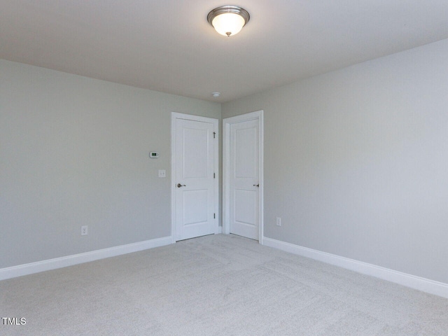 354 Crimson Way, Pittsboro, NC 27312 - spare room featuring light colored carpet and baseboards
