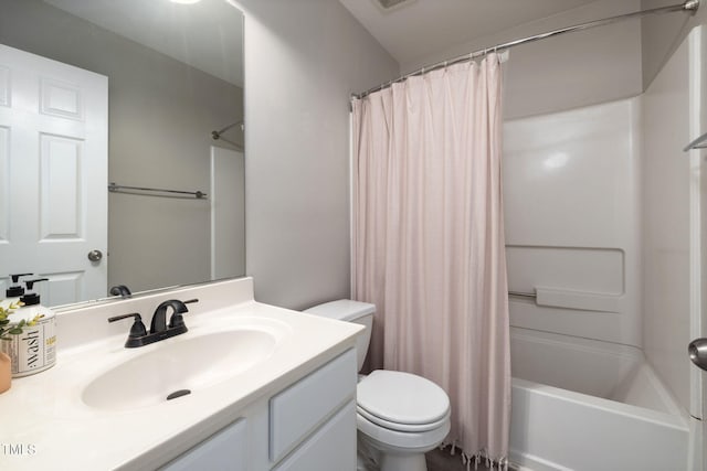 full bathroom featuring toilet, shower / tub combo, and vanity