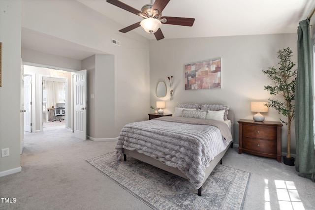 bedroom featuring baseboards, visible vents, light carpet, and lofted ceiling
