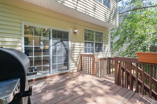 wooden terrace with area for grilling