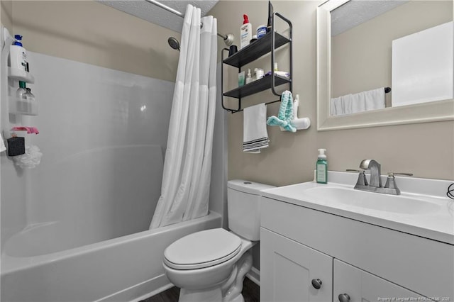 full bathroom featuring toilet, a textured ceiling, shower / bath combination with curtain, and vanity