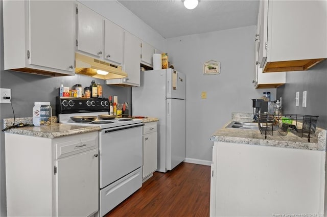 kitchen with white appliances, light countertops, white cabinetry, under cabinet range hood, and dark wood finished floors