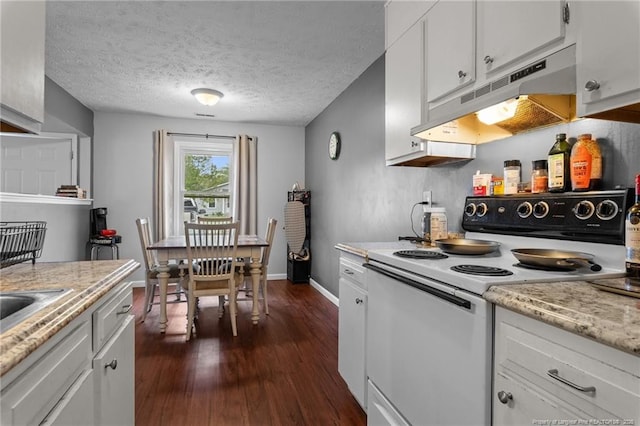 kitchen featuring white electric range, dark wood finished floors, baseboards, under cabinet range hood, and white cabinetry
