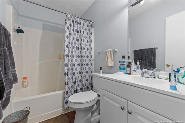 bathroom with vanity, toilet, a textured ceiling, and shower / tub combo with curtain