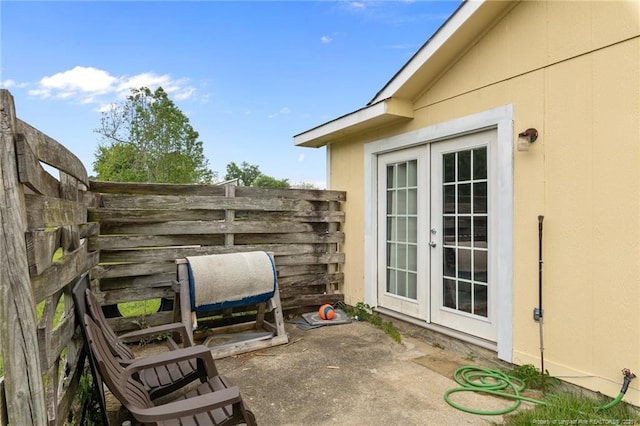 view of patio / terrace with fence and french doors