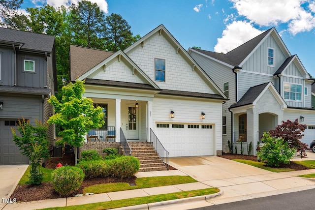 151 Monteith Dr, Chapel Hill, NC 27516 - craftsman house with a porch, board and batten siding, concrete driveway, and a shingled roof