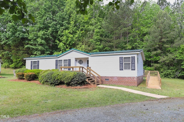 1201 Red Sunset Pl, Siler City, NC 27344 - manufactured / mobile home featuring metal roof, a front yard, and crawl space