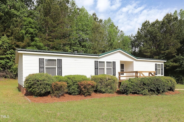 1201 Red Sunset Pl, Siler City, NC 27344 - manufactured / mobile home featuring metal roof and a front yard