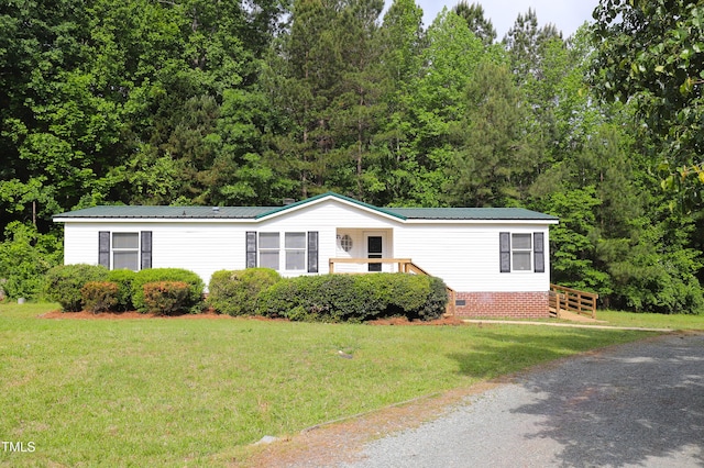 1201 Red Sunset Pl, Siler City, NC 27344 - manufactured / mobile home with a front lawn, crawl space, and metal roof
