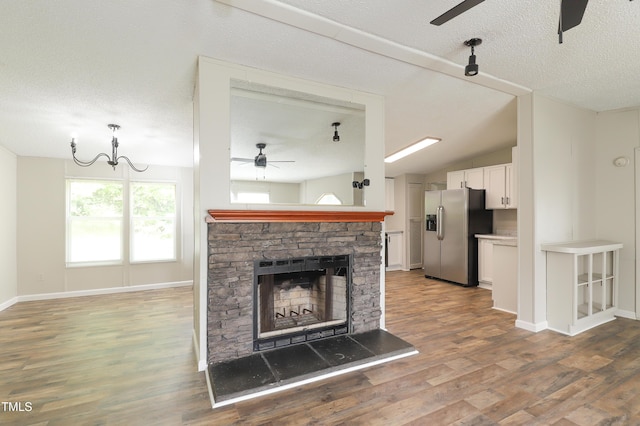 1201 Red Sunset Pl, Siler City, NC 27344 - unfurnished living room with vaulted ceiling, ceiling fan, baseboards, and wood finished floors