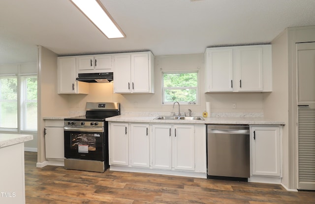 1201 Red Sunset Pl, Siler City, NC 27344 - kitchen featuring under cabinet range hood, stainless steel appliances, white cabinets, and a sink