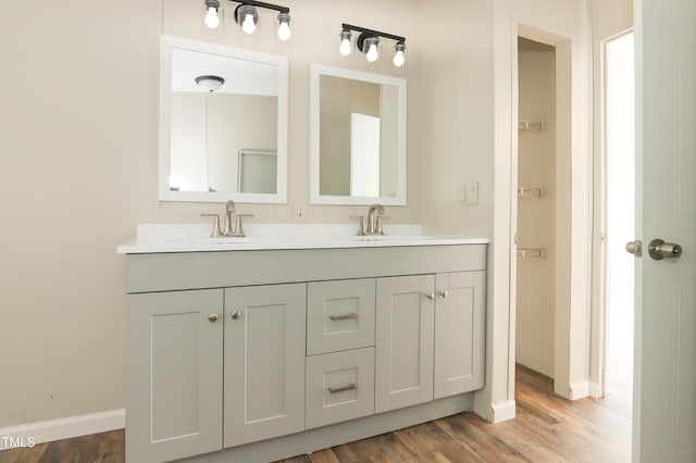 1201 Red Sunset Pl, Siler City, NC 27344 - full bath featuring double vanity, wood finished floors, baseboards, and a sink